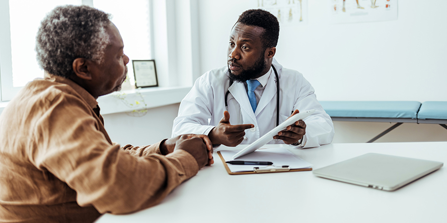 Medical consultation between doctor and his patient.