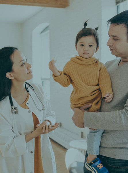 Father and child seeing doctor